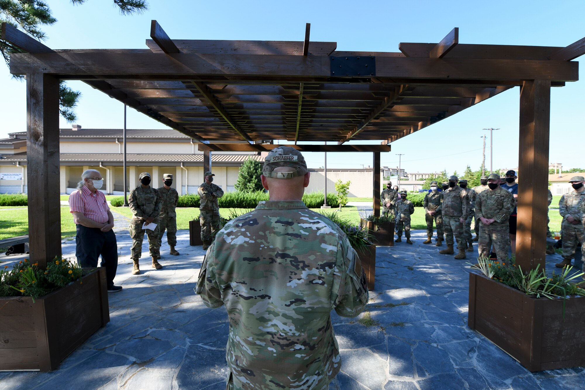 U.S. Air Force Chief Master Sgt. Thomas Schaeffer, 8th Fighter Wing command chief, provides opening remarks during the Wolf Pack Legacy Garden dedication ceremony at Kunsan Air Base, Republic of Korea, Aug 28, 2021. Volunteers from across Kunsan Air Base dedicated hours of woodworking, gardening, painting and more to ensure the garden was built and dedicated to veterans by Sept 8, 2021. (U.S. Air Force photo by Staff Sgt. Jesenia Landaverde)