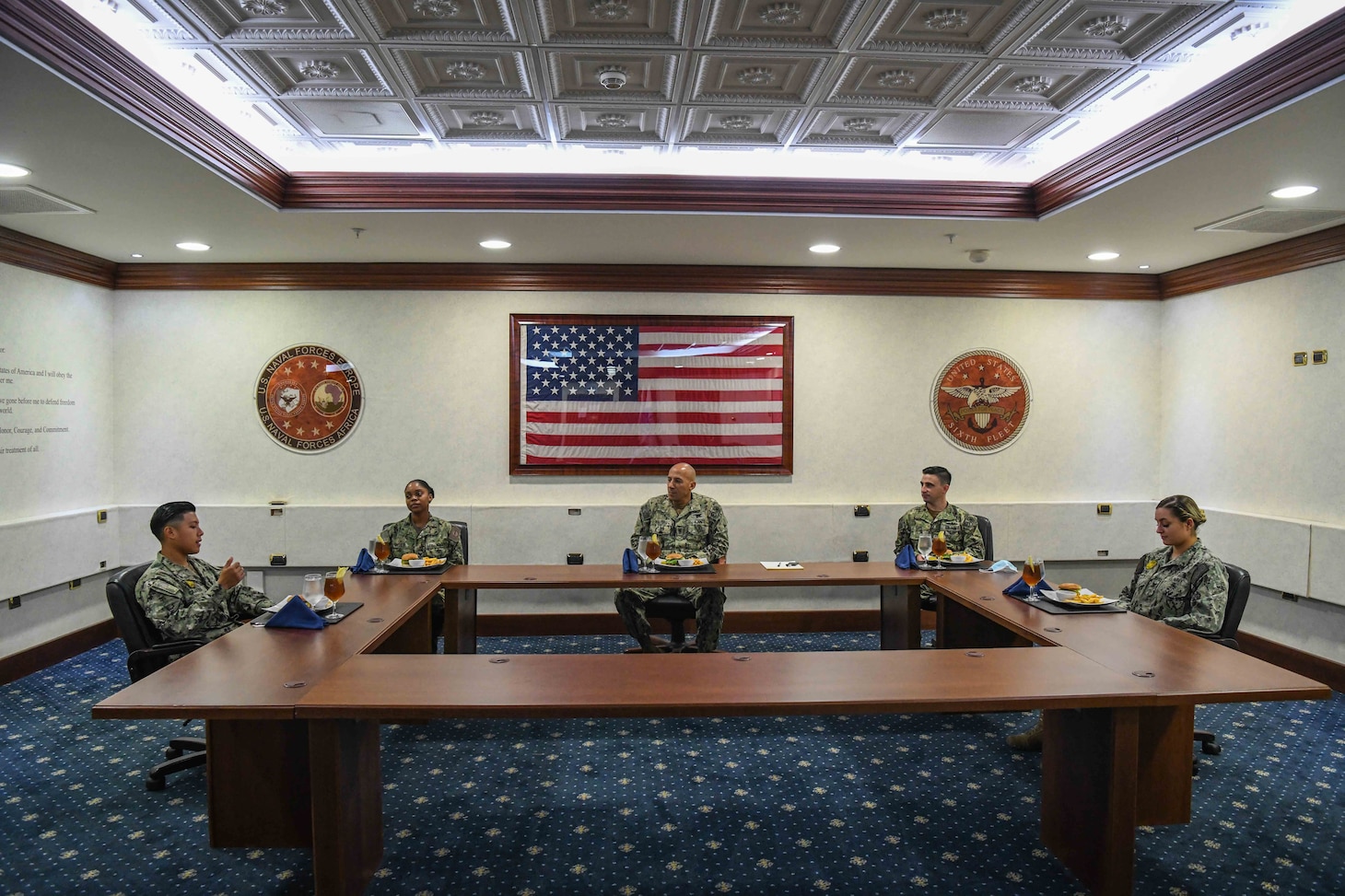 (Aug. 11, 2021) U.S. Naval Forces Europe and Africa Fleet Master Chief Derrick Walters, center, hosts a “Breaking Bread with the Best” luncheon with top performing Sailors in the European and African theaters, Aug. 11, 2021. U.S. Naval Forces Europe and Africa, headquartered in Naples, Italy, conducts the full spectrum of joint and naval operations, often in concert with allied and interagency partners, in order to advance U.S. national security interests and stability in Europe and Africa.