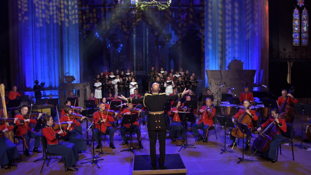 In honor of the 20th anniversary of 9/11, “The President’s Own” United States Marine Band premieres an original piece of music composed by Assistant Director Maj. Ryan J. Nowlin. In a special video production, the composition’s first performance was captured under the glowing stained glass of the Washington National Cathedral, while being played by the Marine Chamber Orchestra accompanied by a Joint Armed Forces Chorus. The piece takes its name, "These Lights, Which Shine," from a translation of a poem by Hannah Senesh titled "There are Stars."