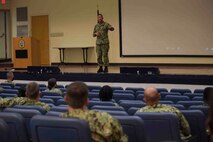 NAVAL STATION NORFOLK (Sept. 9, 2021) Naval Surface Force Atlantic Force Master Chief Jason Knupp speaks during a 9/11 20th anniversary remembrance ceremony, Sept. 9. The ceremony honored those affected by the deadliest series of terrorist attacks since Pearl Harbor, affirming the United States Navy’s ongoing commitment to deter future terrorist attacks and to never forget our American legacy of tenacity and resiliency.  (U.S. Navy photo by Mass Communication Specialist 1st Class Jacob Milham)