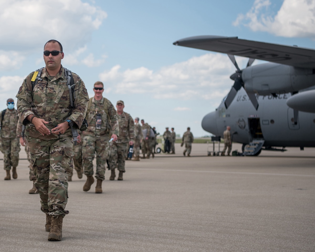 Airmen from the 123rd Contingency Response Group return to the Kentucky Air National Guard Base in Louisville, Ky., Sept. 8, 2021, after completing an 18-day mission at Volk Field, Wis., to receive Afghan evacuees arriving aboard military and civilian aircraft. The Airmen processed 87 aircraft carrying more than 11,000 evacuees as part of Operation Allies Refuge and the follow-on mission, Operation Allies Welcome. The evacuees were then sent to nearby Fort McCoy, Wis. The Department of Defense, through U.S. Northern Command and in support of the Department of Homeland Security, is providing transportation, temporary housing, medical screening and general support for at least 50,000 Afghan evacuees at suitable facilities, in permanent or temporary structures, as quickly as possible. This initiative provides Afghan personnel essential support at secure locations outside Afghanistan. (U.S. Air National Guard photo by Tech. Sgt. Joshua Horton)