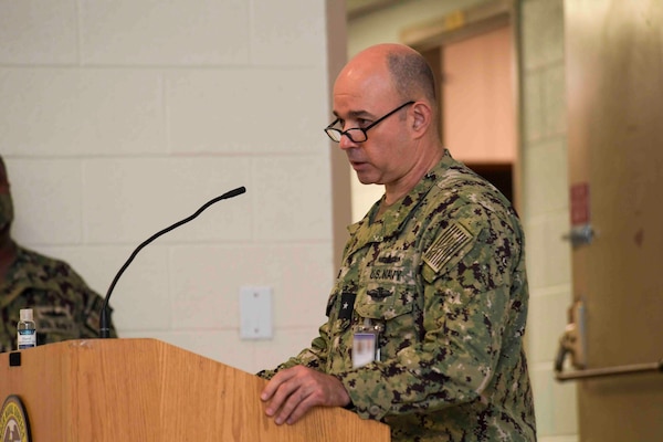 NAVAL STATION NORFOLK (Sept. 9, 2021) Rear Adm. Marc Lederer, Deputy Commander, Naval Surface Force Atlantic, speaks during a 9/11 20th anniversary remembrance ceremony, Sept. 9. The ceremony honored those affected by the deadliest series of terrorist attacks since Pearl Harbor, affirming the United States Navy’s ongoing commitment to deter future terrorist attacks and to never forget our American legacy of tenacity and resiliency.  (U.S. Navy photo by Mass Communication Specialist 1st Class Jacob Milham) (This photo has been altered for security purposes by blurring out identification badges.)