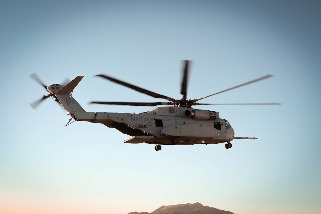A Marine Corps CH-53K King Stallion flies over the Eastern Sierra Regional Airport during a mission to recover a Navy MH-60S Knighthawk Helicopter, Bishop, California, Sept. 5, 2021.  The two day operation was the first official fleet mission for the CH-53K King Stallion, as it is currently undergoing an operational assessment while the Marine Corps modernizes and prepares to respond globally to emerging crises or contingencies. (U.S. Marine Corps photo by Cpl. Therese Edwards)