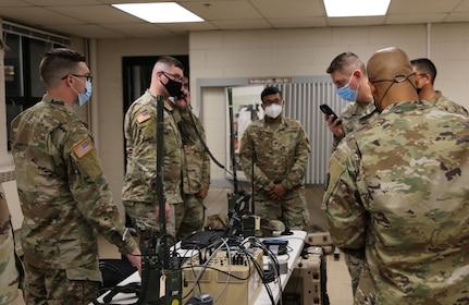 Soldiers from the New Jersey Army National Guard 44th Infantry Brigade Combat Team use a radio bridging voice cross-banding system that is part of the Disaster Incident Response Emergency Communications Terminal (DIRECT) tool suite, on Aug. 20, 2021, in Lawrenceville, New Jersey.