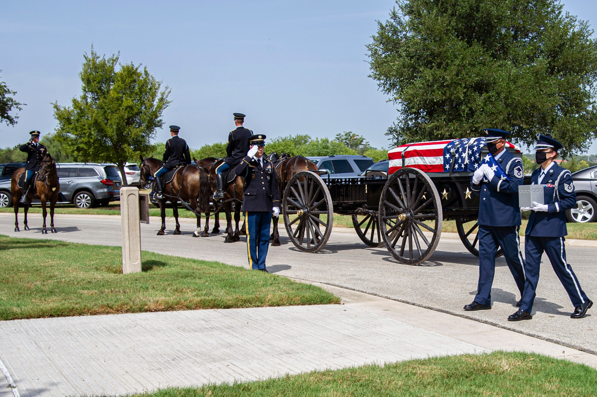 Air Force Honor Guard members carry the remains of retired Col. Richard E. Cole and the U.S. flag during his interment, Sept. 7, 2021.