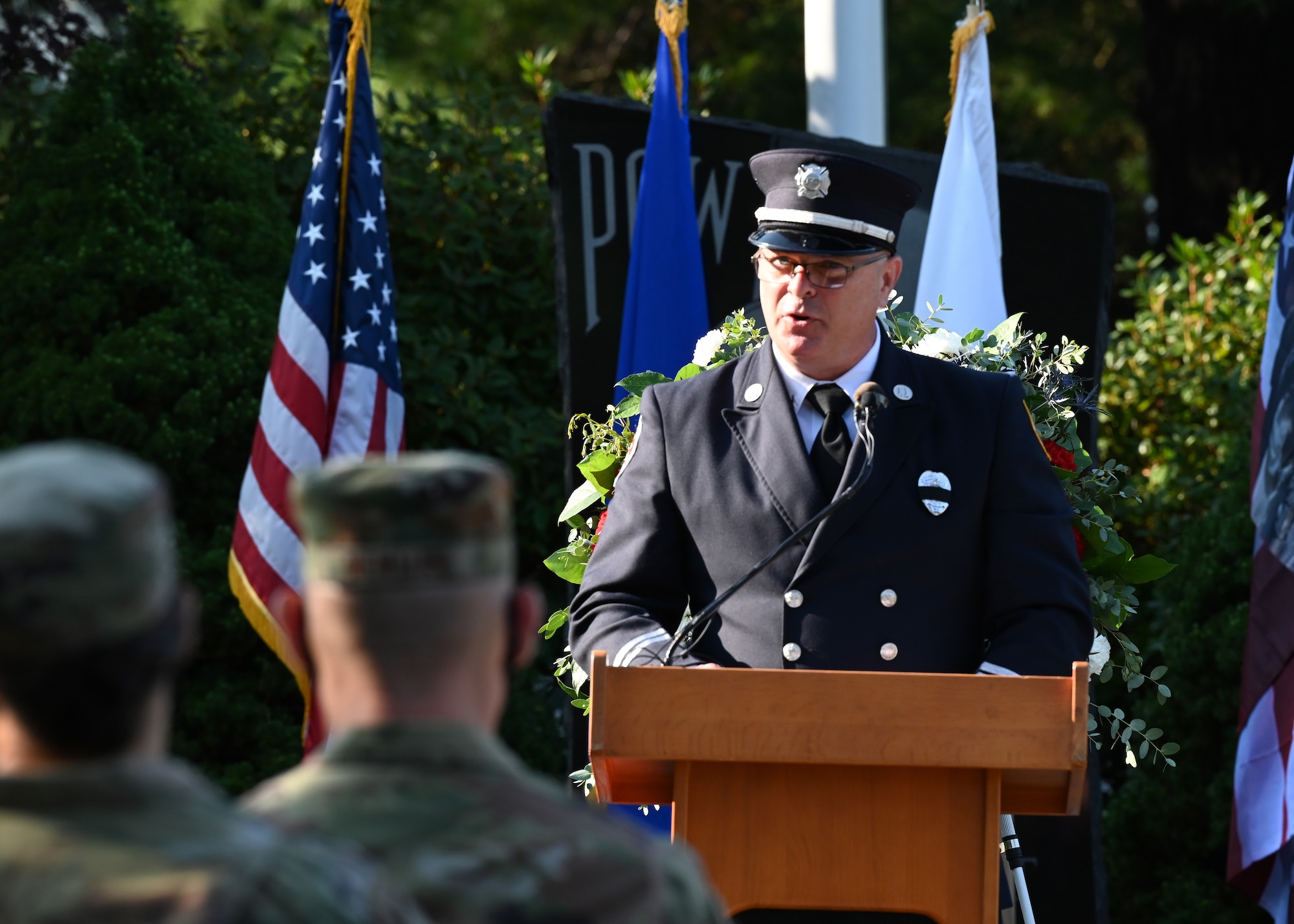 Hanscom Fire Captain Dale Smith speaks during a 9/11 remembrance ceremony