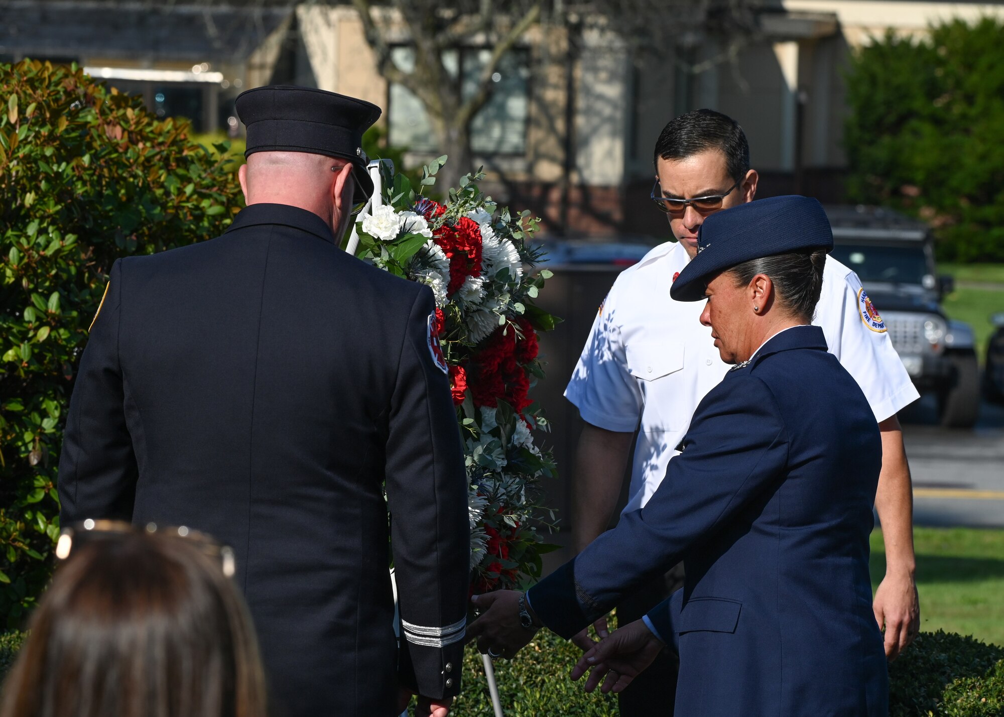 Hanscom first responders, and installation commander lay wreath on monument