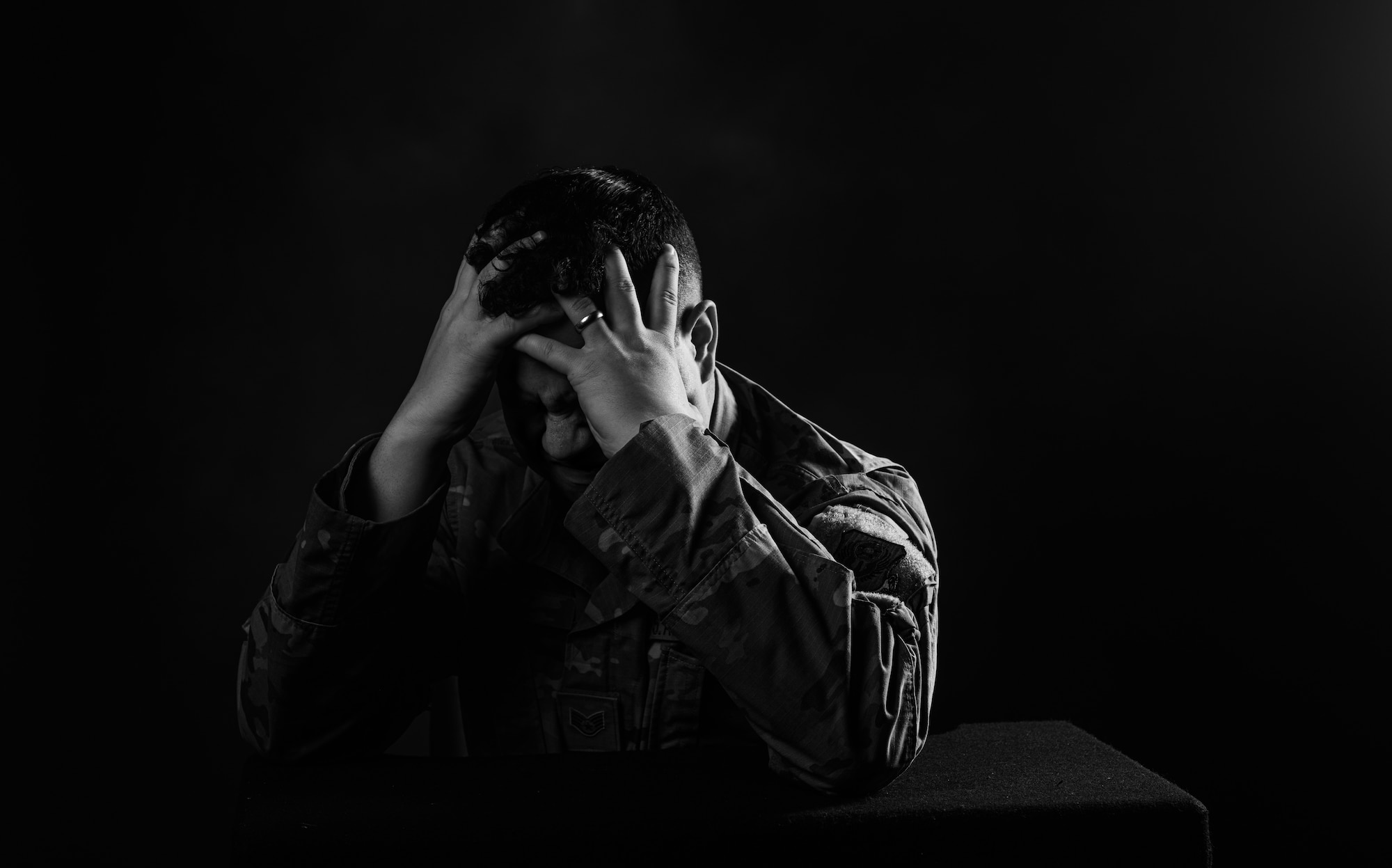 U.S. Air Force Staff Sgt. Candin Muniz, 27th Special Operations Wing Public Affairs noncommissioned officer in charge of command information, poses as a distressed Airmen for moral injury training at Cannon Air Force Base, N.M., Sep. 10, 2021. Moral injury training is meant to help individuals who have experienced work-related events that are in direct violation of their own personal morals, voluntarily or otherwise. The Cannon AFB Chaplain Corps has introduced the training to the base to get help to those who need it. (U.S. Air Force photo by Senior Airman Christopher Storer)