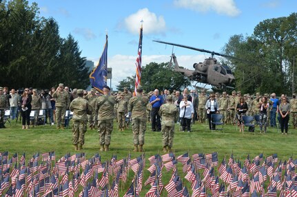 The color guard presents the flag during a 9/11 remembrance ceremony at New York National Guard headquarters in Latham, New York Sept. 10, 2021. The ceremony took place in front of a backdrop of 2,977 small American flags representing each of the people killed during the Sept. 11, 2001, attacks.