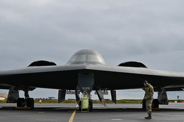 Staff Sgt. Ian Simms, 110th Expeditionary Bomb Squadron dedicated crew chief, prepares a B-2 Spirit stealth bomber for departure from Keflavik Air Base, Iceland, Sept. 8, 2021. The stealth bombers integrated with Royal Norwegian Air Force F-35A Lightning II aircraft enhancing bomber interoperability with partners and allied nations. (U.S. Air Force photo by Airman 1st Class Victoria Hommel)