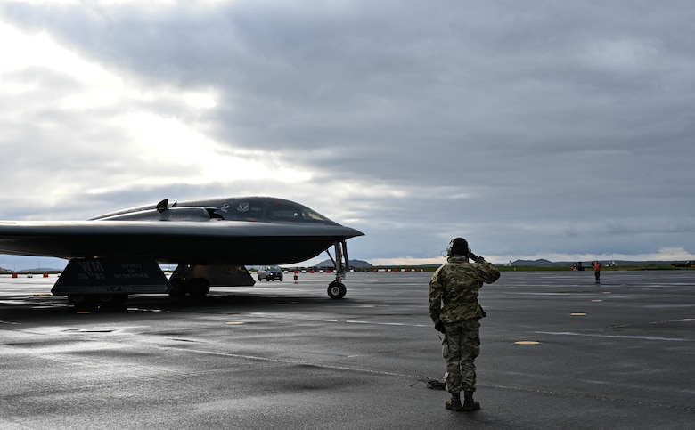 Staff Sgt. Ian Simms, 110th Expeditionary Bomb Squadron dedicated crew chief, prepares a B-2 Spirit stealth bomber for departure from Keflavik Air Base, Iceland, Sept. 8, 2021. The stealth bombers integrated with Royal Norwegian Air Force F-35A Lightning II enhancing bomber interoperability with partners and allied nations. (U.S. Air Force photo by Airman 1st Class Victoria Hommel)
