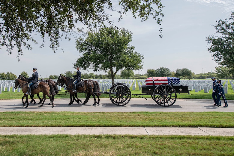 Soldiers with the Fort Sam Houston Caisson Section carry the flag-draped remains of Col. Richard E. Cole during his interment ceremony Sept. 7 at the Fort Sam Houston National Cemetery, Texas.