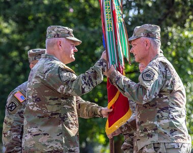 Gen. Glen D. VanHerck (right), Commander, North American Aerospace Defense Command and United States Northern Command, passes the U.S. Army North colors to Lt. Gen. John R. Evans, Jr.