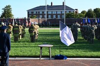 Attendees observe and salute as members of The United States Air Force Honor Guard raise the American flag during a 9/11 memorial ceremony at Joint Base Anacostia- Bolling, Washington D.C. on Sept. 10, 2021. Mission partners from across the National Capitol Region gathered at JB Anacostia-Bolling to honor those who died 20 years ago during the terror attacks on the World Trade Center and the Pentagon on September 11, 2001. (U.S. Air Force photo by Staff Sgt. Kayla White)