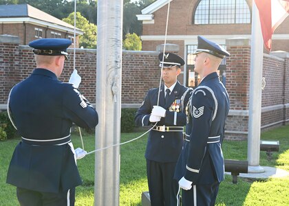 Airmen of The United States Air Force Honor Guard raise the American flag during a 9/11 memorial ceremony at Joint Base Anacostia-Bolling, Washington D.C. Mission partners from across the National Capitol Region gathered at JB Anacostia-Bolling to honor those who died 20 years ago during the terror attacks on the World Trade Center and the Pentagon on September 11, 2001. (U.S. Air Force photo by Staff Sgt. Kayla White)