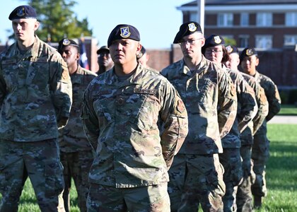 Airmen of the 11th Security Forces Squadron stand during a 9/11 memorial ceremony at Joint Base Anacostia-Bolling, Washington D.C. on Sept. 10, 2021. Mission partners from across the National Capitol Region gathered at JB Anacostia-Bolling to honor those who died 20 years ago during the terror attacks on the World Trade Center and the Pentagon on September 11, 2001. (U.S. Air Force photo by Staff Sgt. Kayla White)