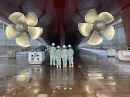 NORFOLK, Va. (Sept. 9, 2021) Members of Mid-Atlantic Regional Maintenance Center’s (MARMC) Waterfront Operations team stand below USS New York (LPD 21) before preparations begin for undocking on the 20th anniversary of September 11.