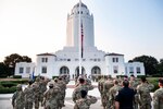 Members of the 502nd Air Base Wing salute as the U.S. flag is lowered to half-staff at Joint Base San Antonio-Randolph Sept. 10 in honor of those lost in the terrorist attacks of Sept. 11, 2001.
