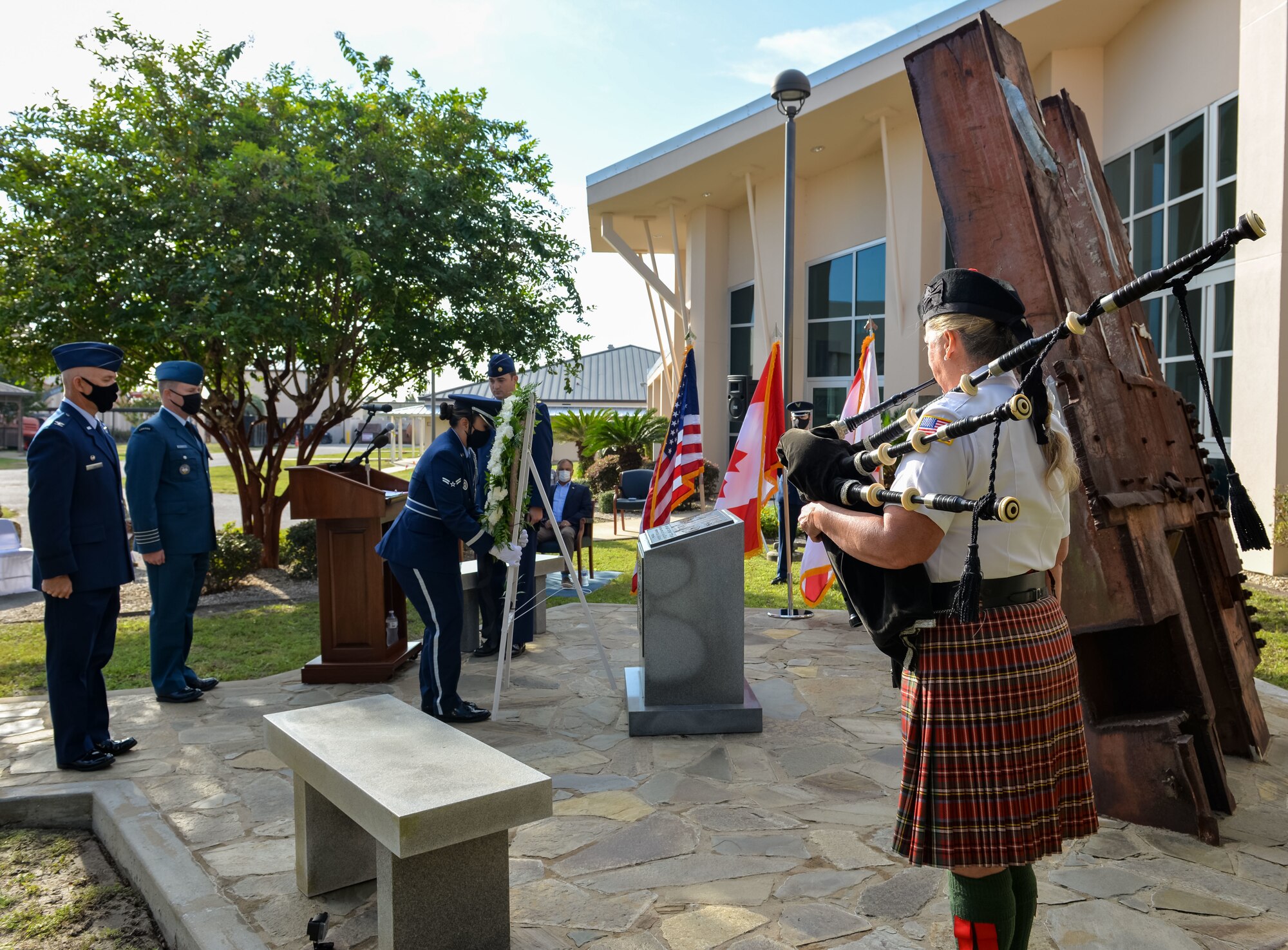 U.S. Air Force Airman 1st Class Kim Tate placed a wreath at the 601st Air Operations Center 9/11 memorial, September 10, 2021, Tyndall Air Force Base, Fla. The 601st AOC held a ceremony to honor the memory of those who lost their lives as a result of the tragic events of September 11, 2001 (Air National Guard photo by, Master Sgt. Regina Young)
