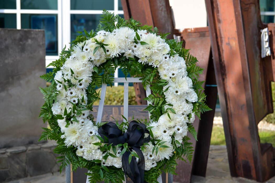 A remembrance wreath lays at the 601st Air Operations Center 9/11 memorial, September 10, 2021, Tyndall Air Force Base, Fla. The 601st AOC held a ceremony to honor the memory of those who lost their lives as a result of the tragic events of September 11, 2001 (Air National Guard photo by, Master Sgt. Regina Young)