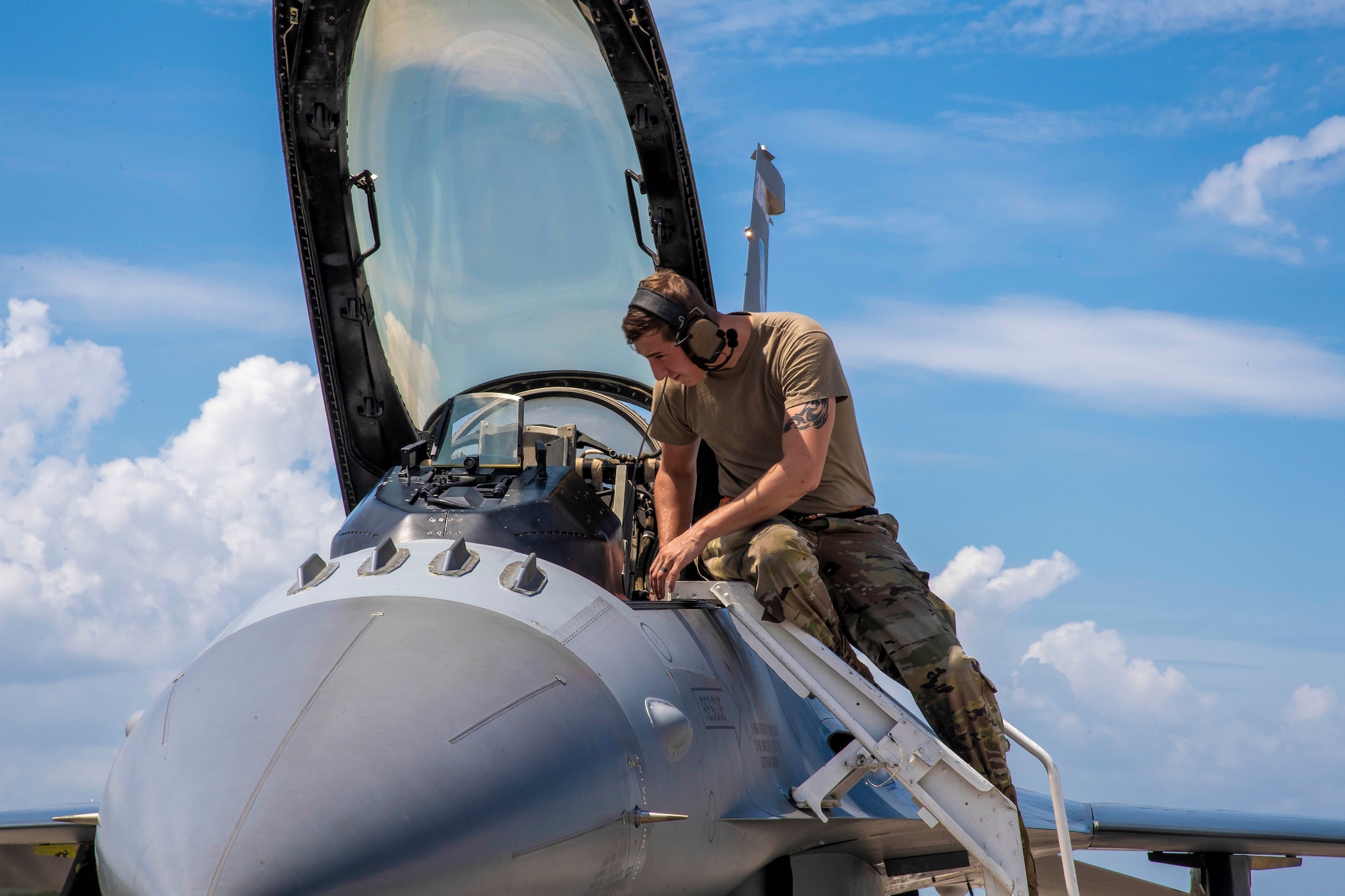 U.S. Air Force Staff Sgt. Chris Rasnick, an avionics technician with the 79th Fighter Squadron, Shaw Air Force Base, South Carolina, performs a preflight check on an F-16 Fighting Falcon aircraft at MacDill Air Force Base, Florida, Sept. 8, 2021.