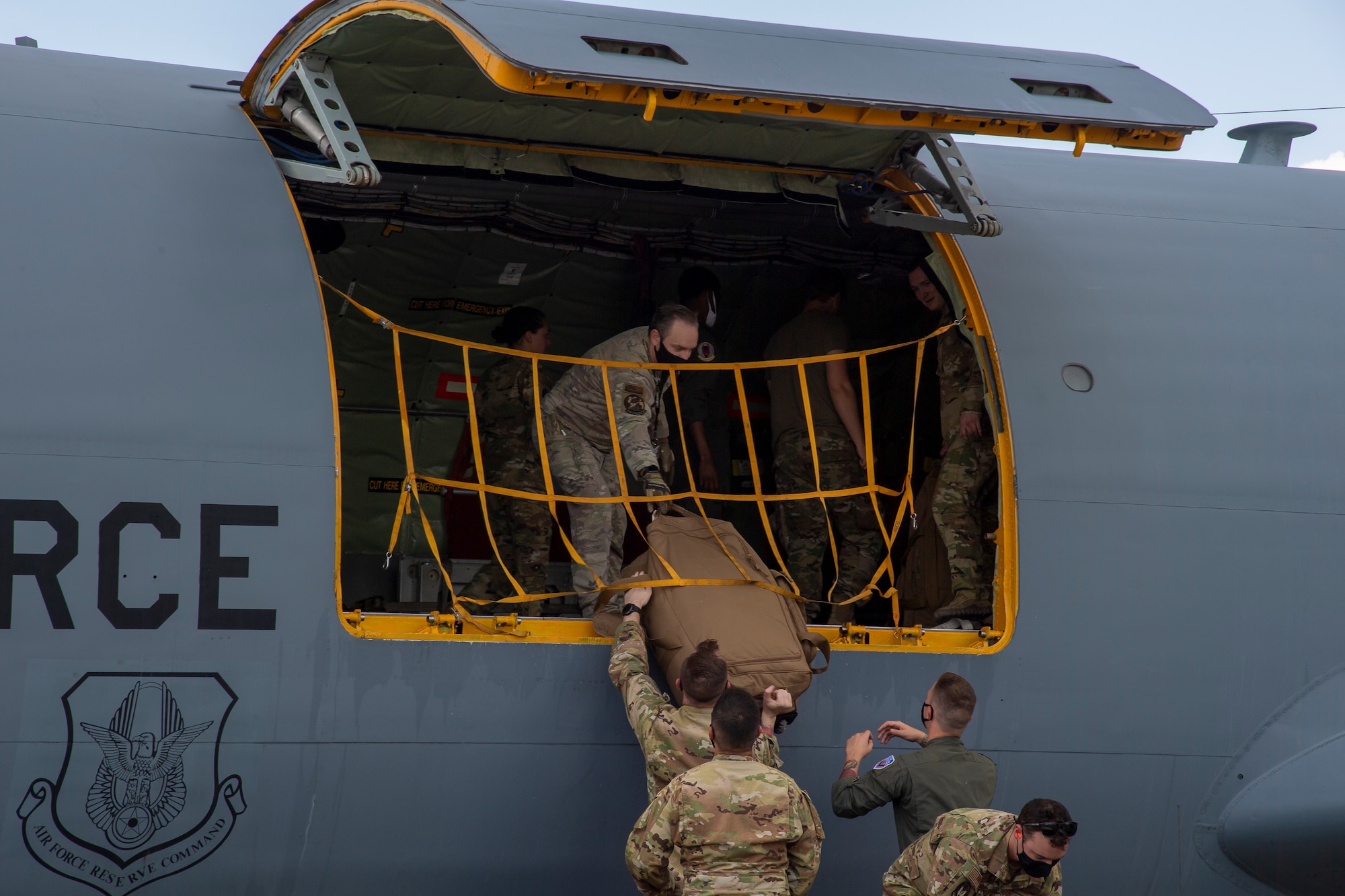 Airmen from the 91st Air Refueling Squadron (ARS) unload a KC-135 Stratotanker aircraft at MacDill Air Force Base, Florida, Sept. 8, 2021.