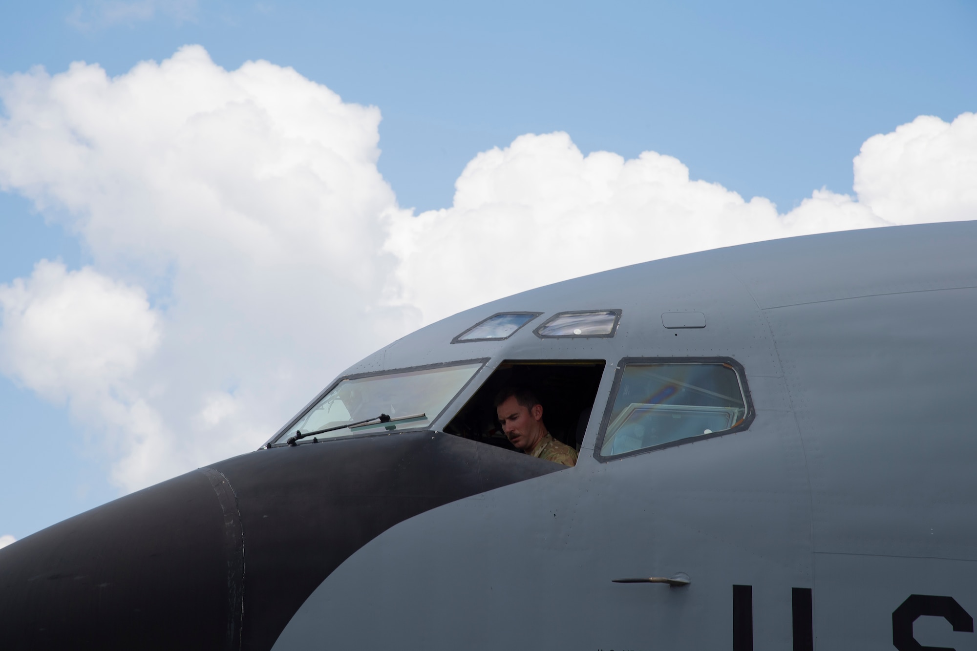 A U.S. Air Force Pilot sits in the cockpit of a KC-135 Stratotanker aircraft after arriving at MacDill Air Force Base, Florida, Sept. 8, 2021.