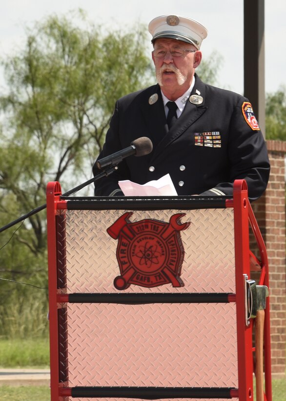 Retired Fire Capt. Mike Dugan, New York City Fire Department, speaks at the 20th Anniversary Commemoration Ceremony, at the Firefighter Memorial Troop Walk, on Goodfellow Air Force Base, Texas, Sept. 8, 2021. Dugan shared his personal experiences regarding his response efforts to rescue victims in the World Trade Center after the attack. (U.S. Air Force by Senior Airman Abbey Rieves)