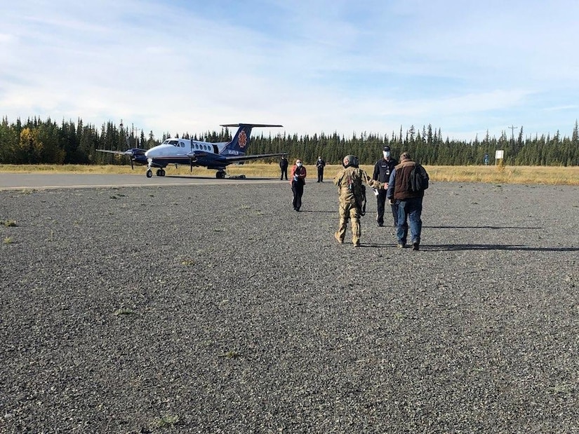 Alaska Army National Guardsmen of 1st Battalion, 207th Aviation Regiment, transfer an individual who was experiencing cardiac issues while hunting near Tyone Lake to a LifeMed aircraft to be transported to a hospital, Sept. 9, 2021.