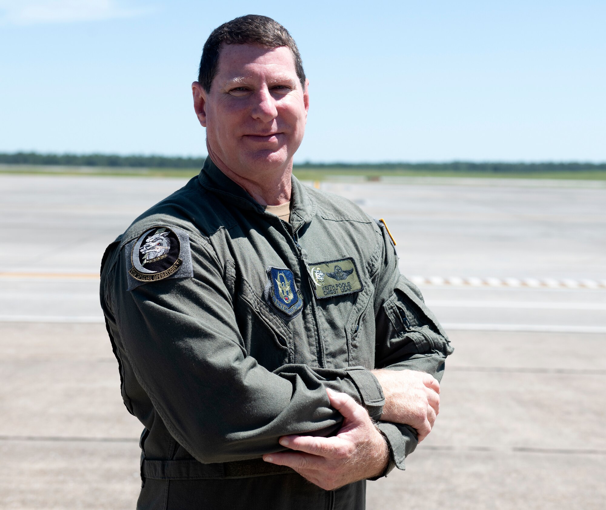 Chief Master Sgt. Keith Poole, 859th Special Operations Squadron Senior Enlisted Leader superintendent poses on the flightline at Duke Field, Florida, Sept. 10, 2021. Poole was a Master Sergeant loadmaster instructor with the 711th Special Operations Squadron at Duke Field during the Operation Enduring Freedom activations that followed the attacks on Sept. 11, 2001. He was one of the many Reservists at Duke Field who was assigned to the MC-130E Combat Talon aircraft.