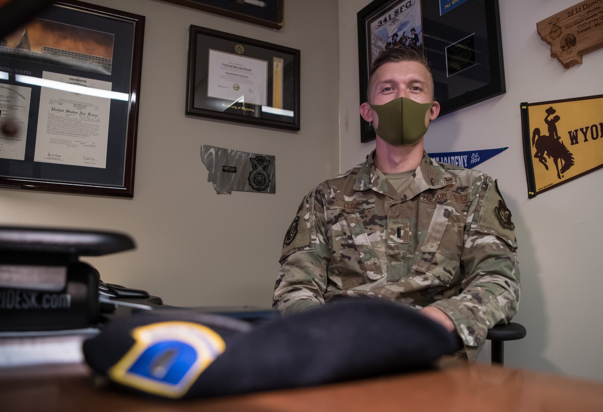 An Airman sitting in his office.