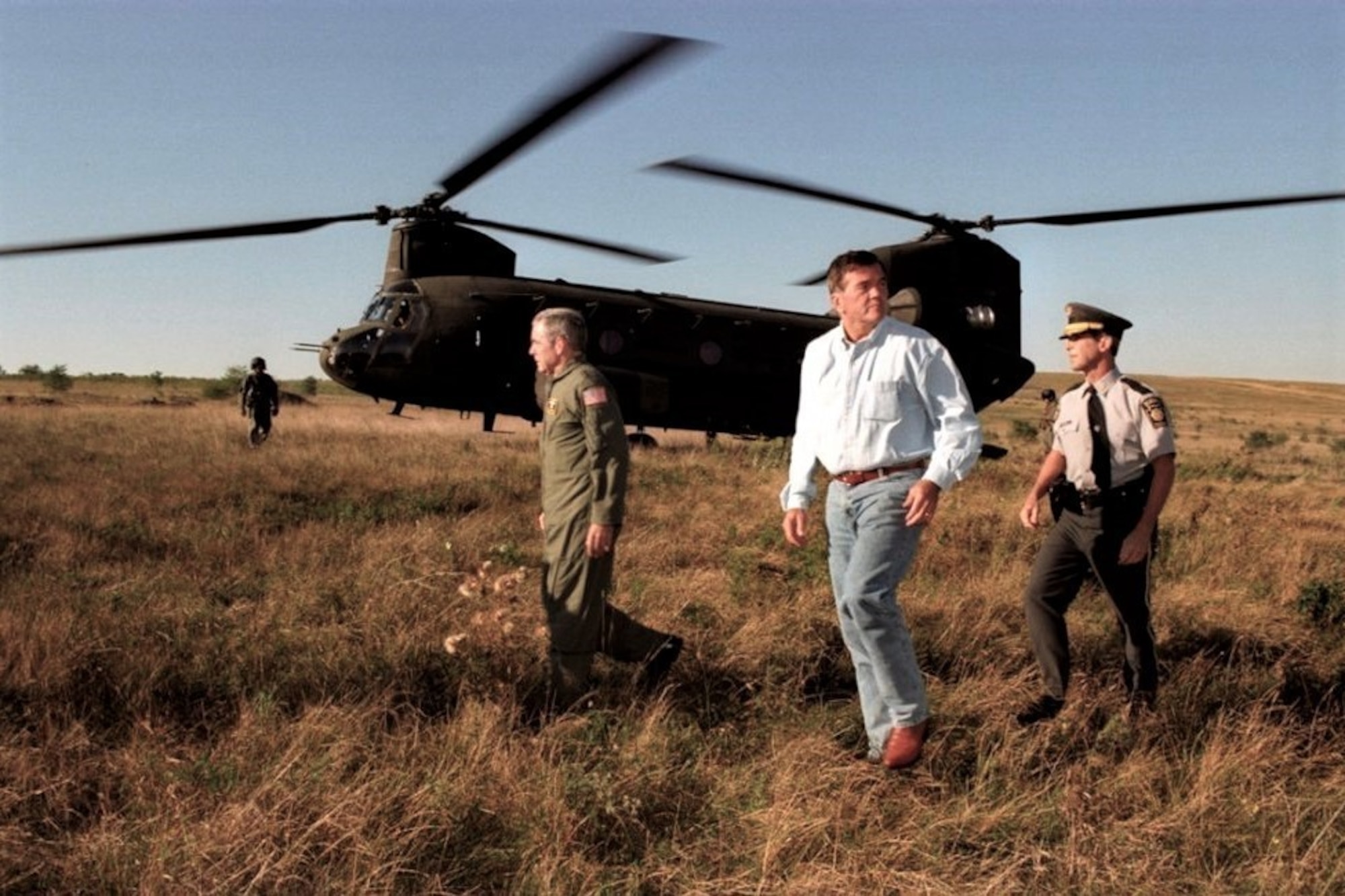 Left to right, Maj. Gen. William Lynch, Pennsylvania National Guard adjutant general; Pennsylvania Gov. Tom Ridge; and Pennsylvania State Police Commissioner Paul Evanko leave a CH-47 Chinook helicopter from the Pennsylvania National Guard's Company G, 104th Aviation Regiment, at the Flight 93 crash site in Somerset County, Pennsylvania, Sept. 11, 2001. (Photo by Terry Way/Commonwealth Media Services)