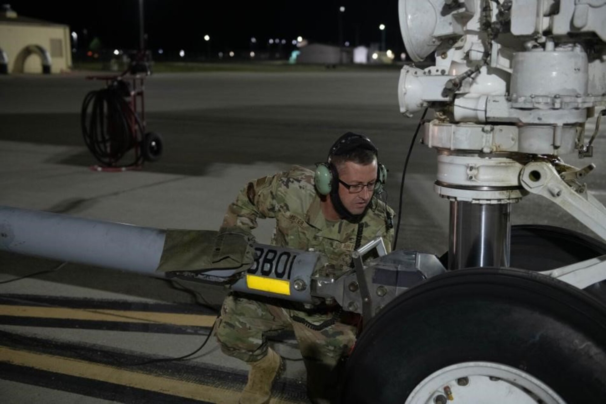 U.S. Air Force Tech. Sgt. Nathan Moyer, 28th Aircraft Maintenance Squadron crew chief, hooks up a tow bar to a B-1B Lancer in support of a Bomber Task Force mission at Ellsworth Air Force Base, S.D., Sept. 8, 2021.