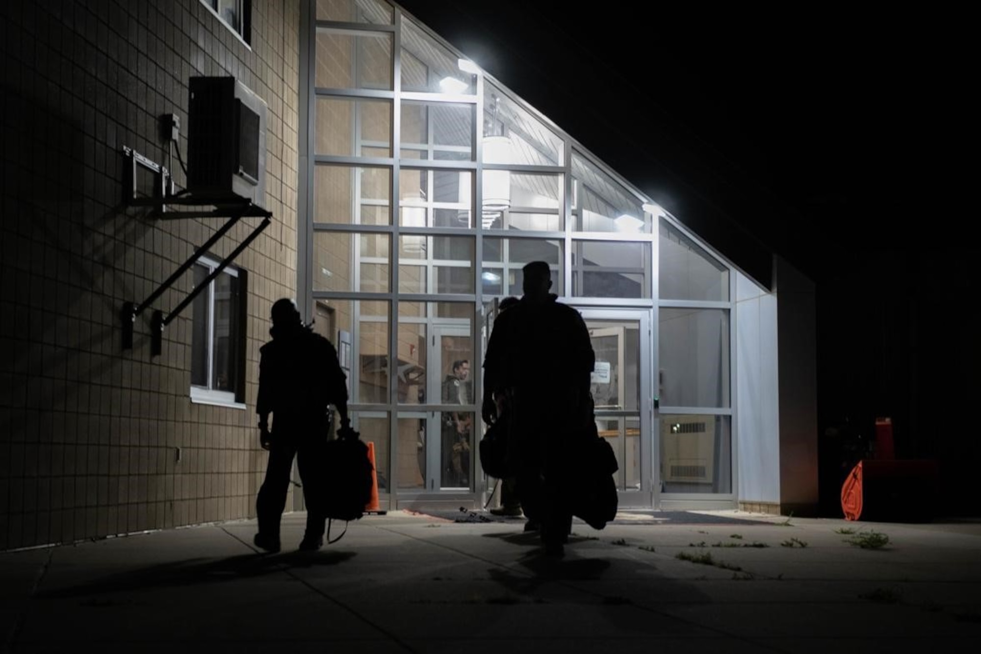 Aviators from the 34th Bomb Squadron walk to buses to transport them to the flightline and their B-1B Lancers prior to a Bomber Task Force mission at Ellsworth Air Force Base, S.D., Sept. 7, 2021.