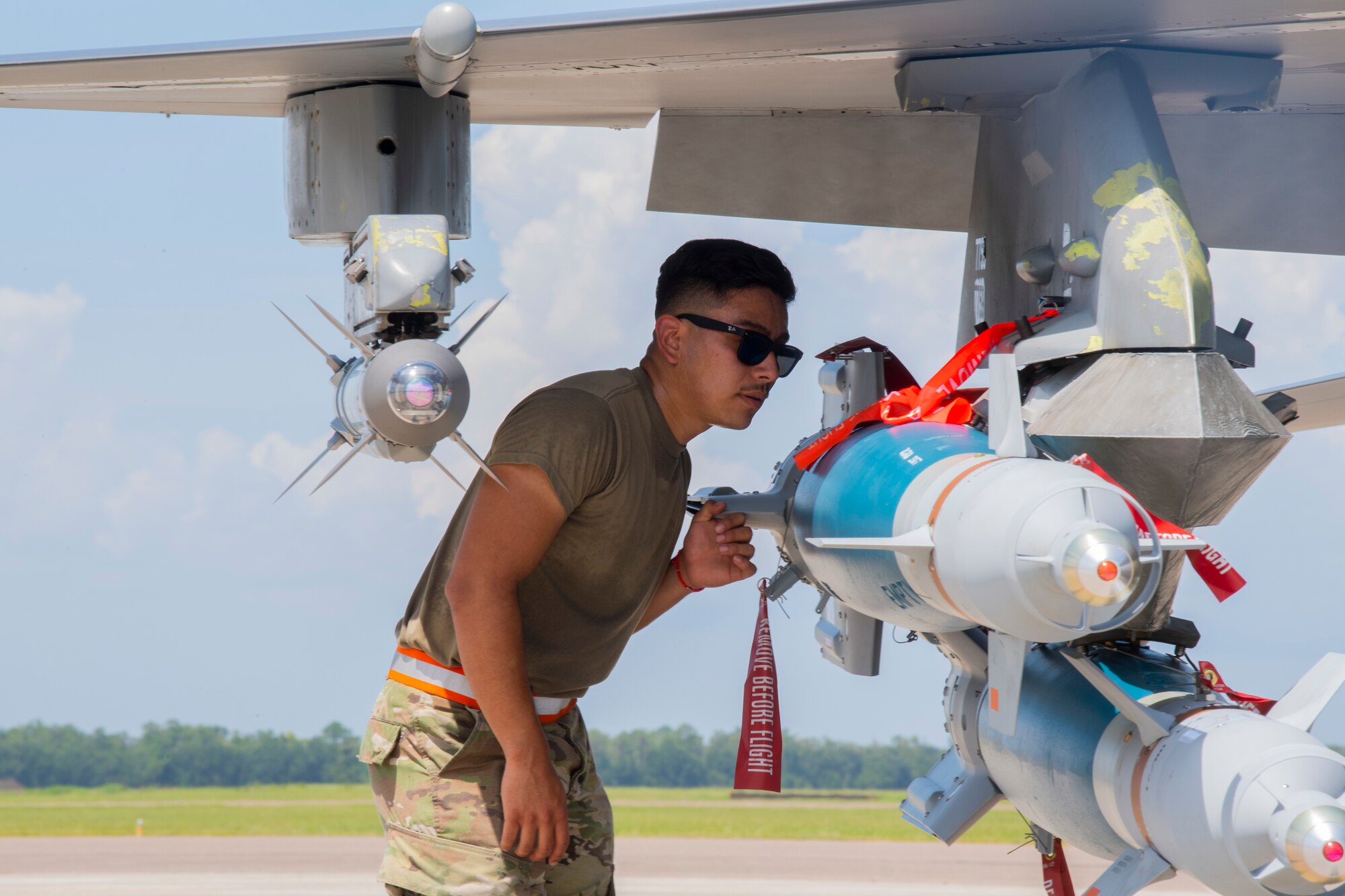 U.S. Air Force Airman 1st Class Carlos Yanez, an aircraft armament systems specialist with the 79th Fighter Squadron (FS), Shaw Air Force Base, South Carolina, inspects the missiles on an F-16 Fighting Falcon aircraft at MacDill Air Force Base, Florida, Sept. 8, 2021.
