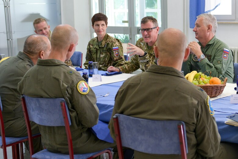 BG Roman Urbanč, deputy chief of the general staff of the Slovenian armed forces, speaks with U.S. Air Force Brig. Gen. Jason E. Bailey, 31st Fighter Wing commander, middle, and U.S. Air Force Gen. Jeff Harrigian, U.S. Air Forces in Europe and Air Forces Africa commander, left, at Cerklje ob Krki Air Base, Slovenia, Sept. 9, 2021. The visit highlighted bilateral operations and interoperability between U.S. and Slovenian Armed Forces in support of the NATO Agile Combat Employment concept. The ACE concept is intended to ensure USAFE-AFAFRICA forces are ready for potential threats and contingencies by enabling forces to quickly disperse and continue to deliver air power from locations with varying levels of capacity and support.
