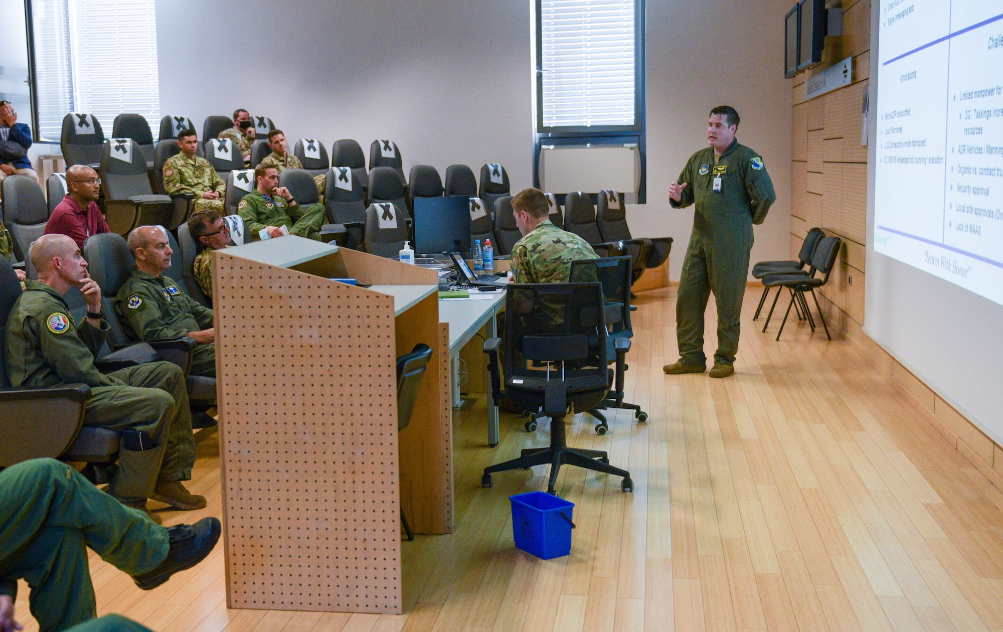 U.S. Air Force Maj. Joseph Basala, 31st Fighter Wing plans and programs chief of agile combat employment, briefs U.S. Air Force Brig. Gen. Jason E. Bailey, 31st Fighter Wing commander, left, U.S. Air Force Gen. Jeff Harrigian, U.S. Air Forces in Europe and Air Forces Africa commander, middle, and BG Roman Urbanč, deputy chief of the general staff of the Slovenian armed forces, on the operations of exercise Agile Wyvern at Cerklje ob Krki Air Base, Slovenia, Sept. 9, 2021. The visit highlighted bilateral operations and interoperability between U.S. and Slovenian Armed Forces in support of the NATO Agile Combat Employment concept. The ACE concept is intended to ensure USAFE-AFAFRICA forces are ready for potential threats and contingencies by enabling forces to quickly disperse and continue to deliver air power from locations with varying levels of capacity and support.