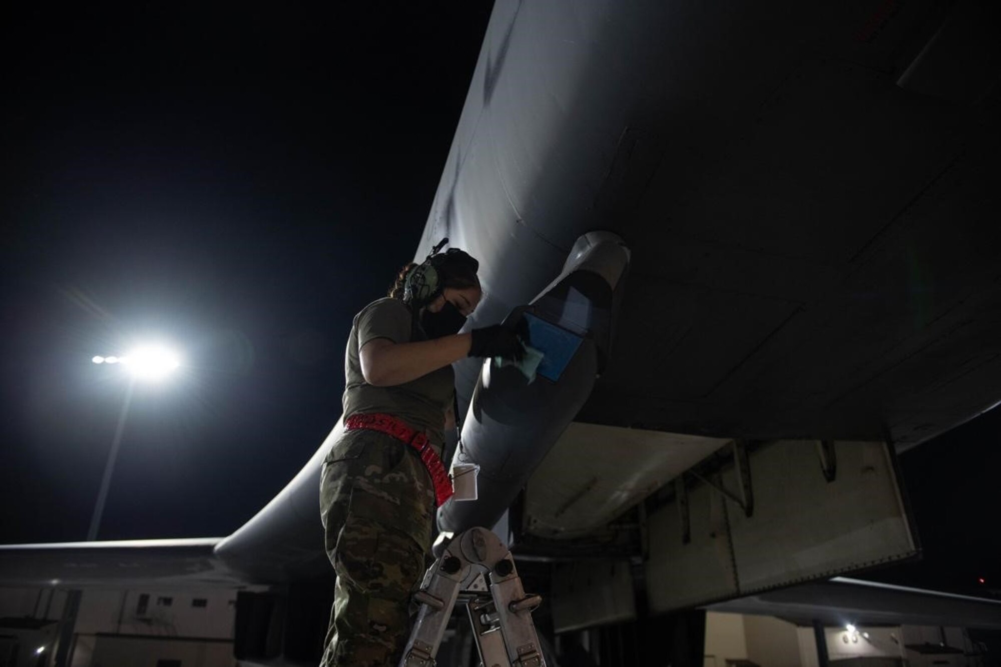 A crew chief from the 28th Aircraft Maintenance Squadron inspects and cleans a sniper advanced targeting pod on a B-1B Lancer in preparation for a Bomber Task Force mission at Ellsworth Air Force Base, S.D., Sept. 7, 2021.