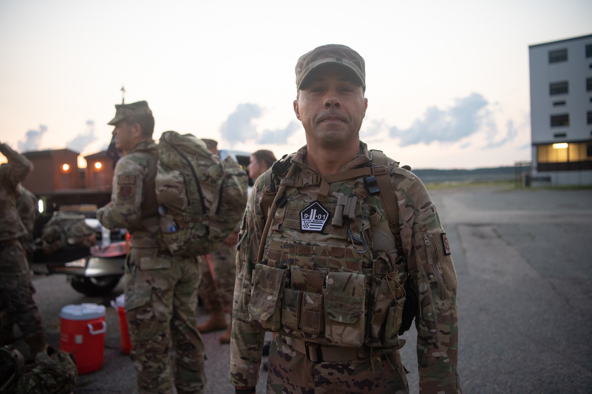 An Airman stands outside in the early morning