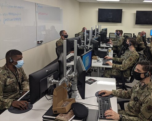 Airmen assigned to the 175th Cyberspace Operations Group sit at computers beta testing the CYDE CARS aptitude test at Warfield Air National Guard Base at Martin State Airport, Middle River, Md., August 7, 2021. The 175th COG Airmen were the first members of the Department of Defense to test this software that will be used across the National Guard. (courtesy photo)