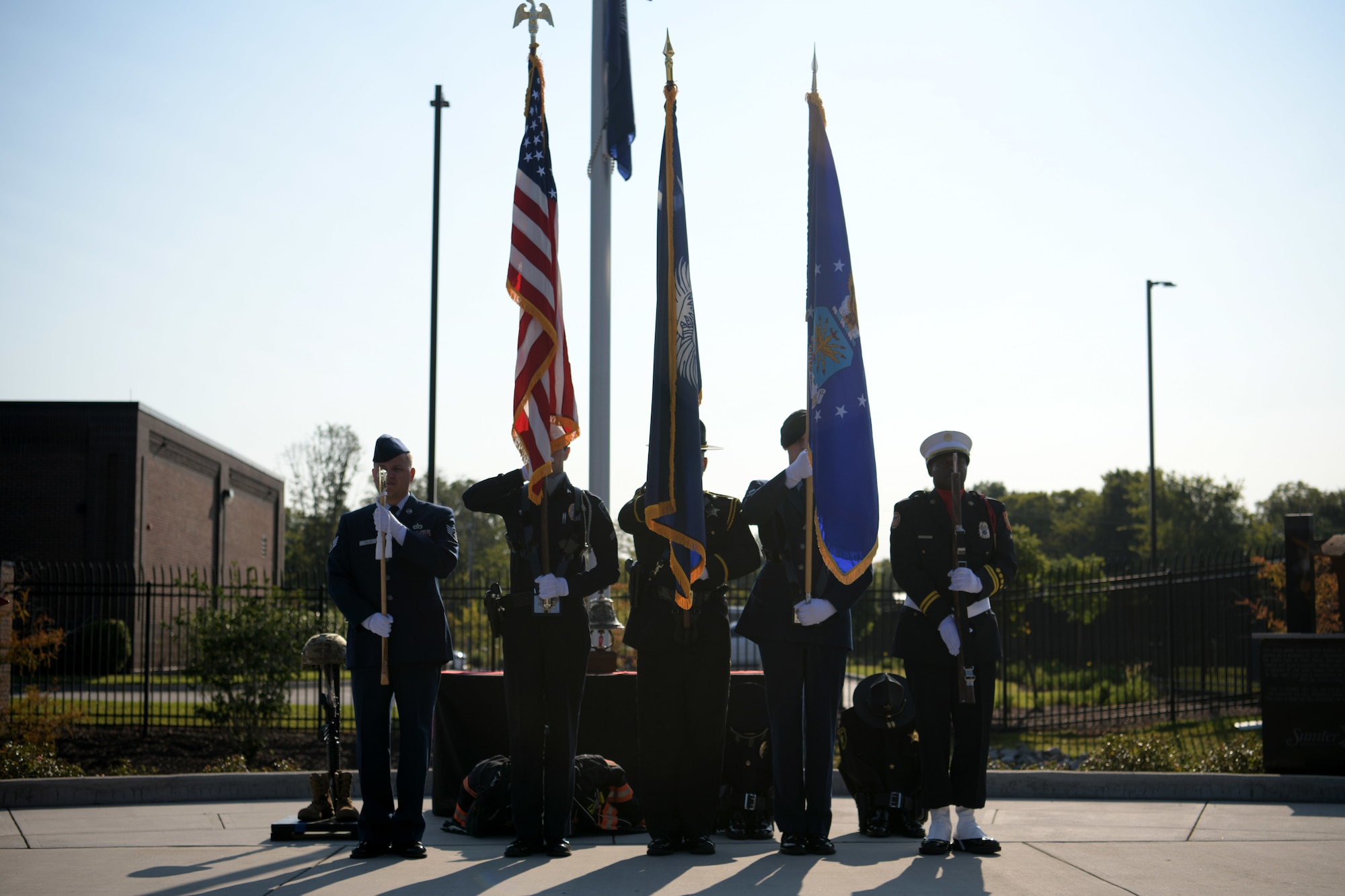 Members of a joint Shaw Air Force Base and Sumter honor guard present the colors as the national anthem is sung during a 9/11 memorial ceremony in Sumter, S.C., Sept. 11, 2021. The ceremony was held in remembrance of the 20th anniversary of the Sept. 11, 2001, attacks across the United States. (U.S. Air Force photo by Staff Sgt. K. Tucker Owen)