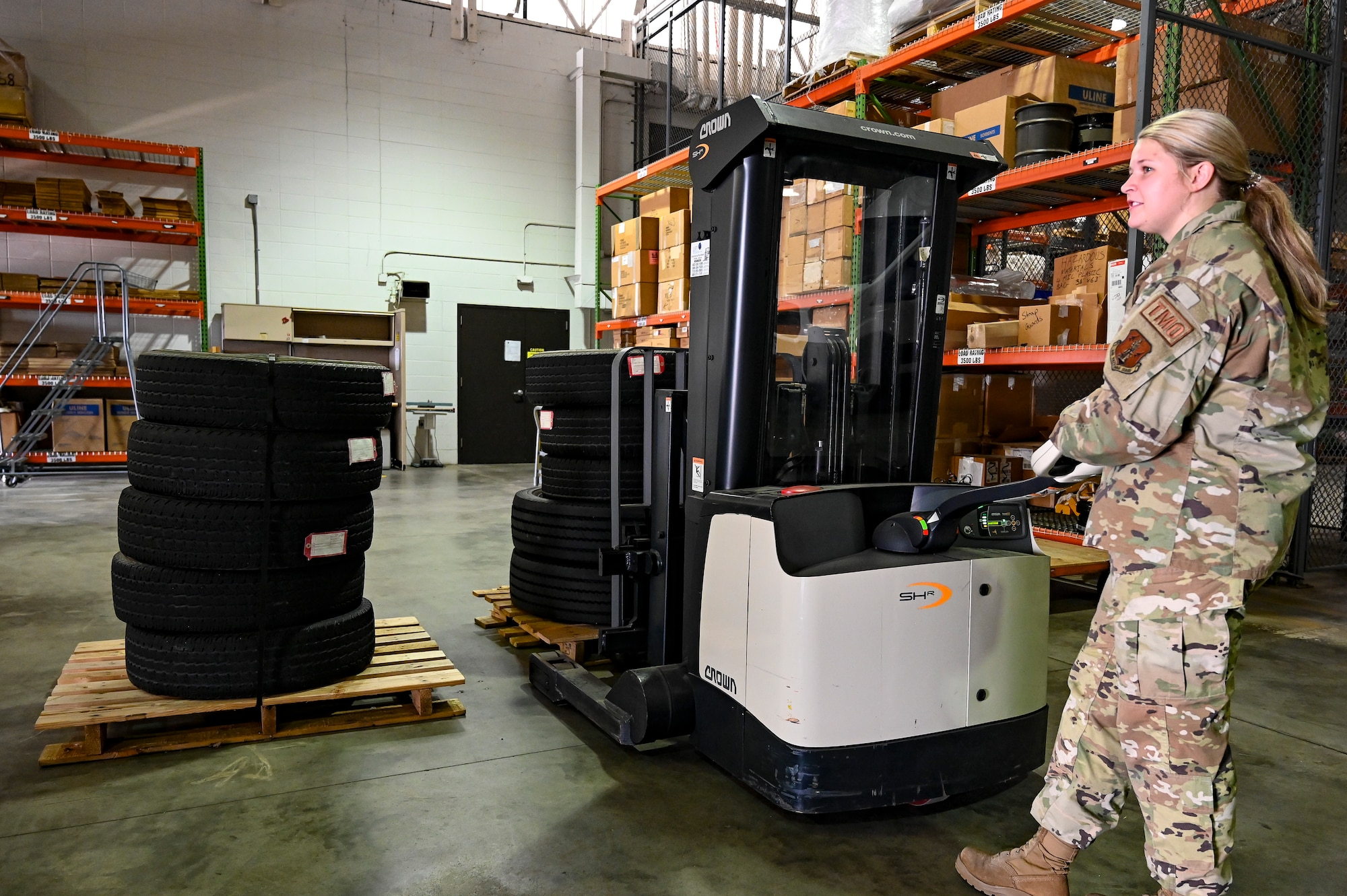 Senior Airman Sadie Vandersteen, 114th Logistics Readiness Squadron Traffic Management Office (TMO) specialist, operates a heavy duty Walkie Stacker while organizing shipments in the TMO warehouse.