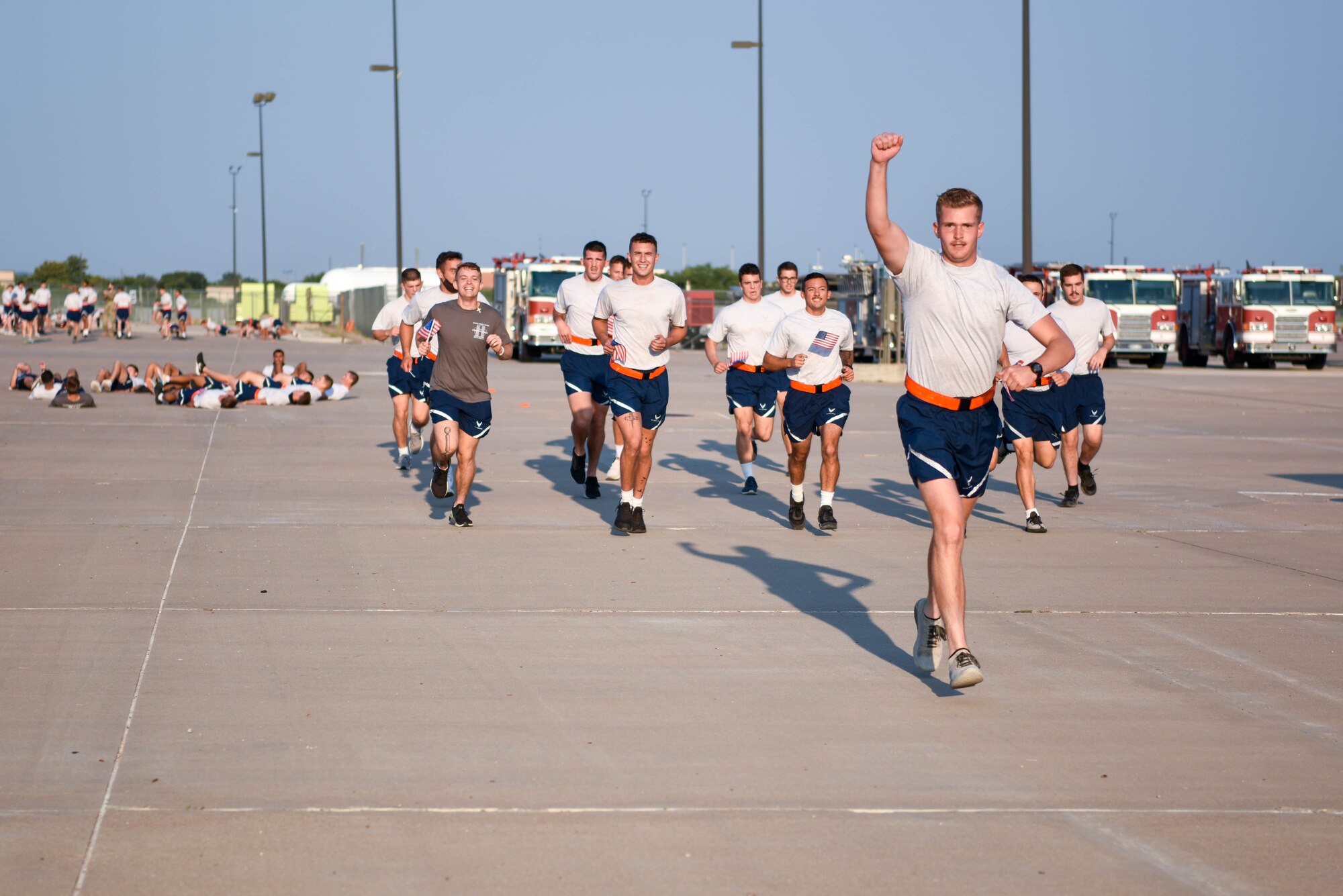 312th Training Squadron students run a two-mile obstacle course during the Blood, Sweat, and Stairs event at the Louis F. Garland Department of Defense Fire Academy on Goodfellow Air Force Base, Texas, Sept. 11, 2021. The event featured a memorial physical training course to remember the firefighters and first responders who risked their lives on 9/11. (U.S. Air Force photo by Senior Airman Jermaine Ayers)