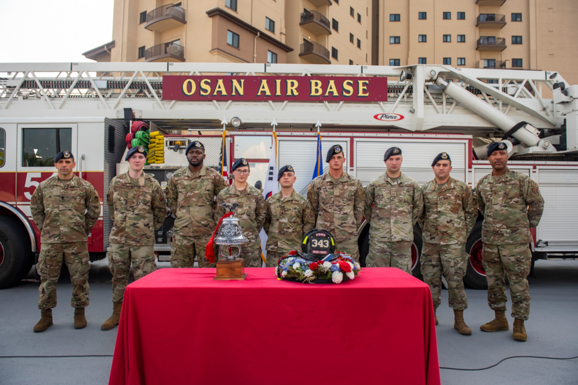 Lt. Col. David Lycan, 51st Fighter Wing Security Forces Squadron commander, left, stands alongside defenders during the culmination of a 20th Anniversary 9/11 Remembrance Ceremony at Osan Air Base, Republic of Korea, Sept. 11, 2021.