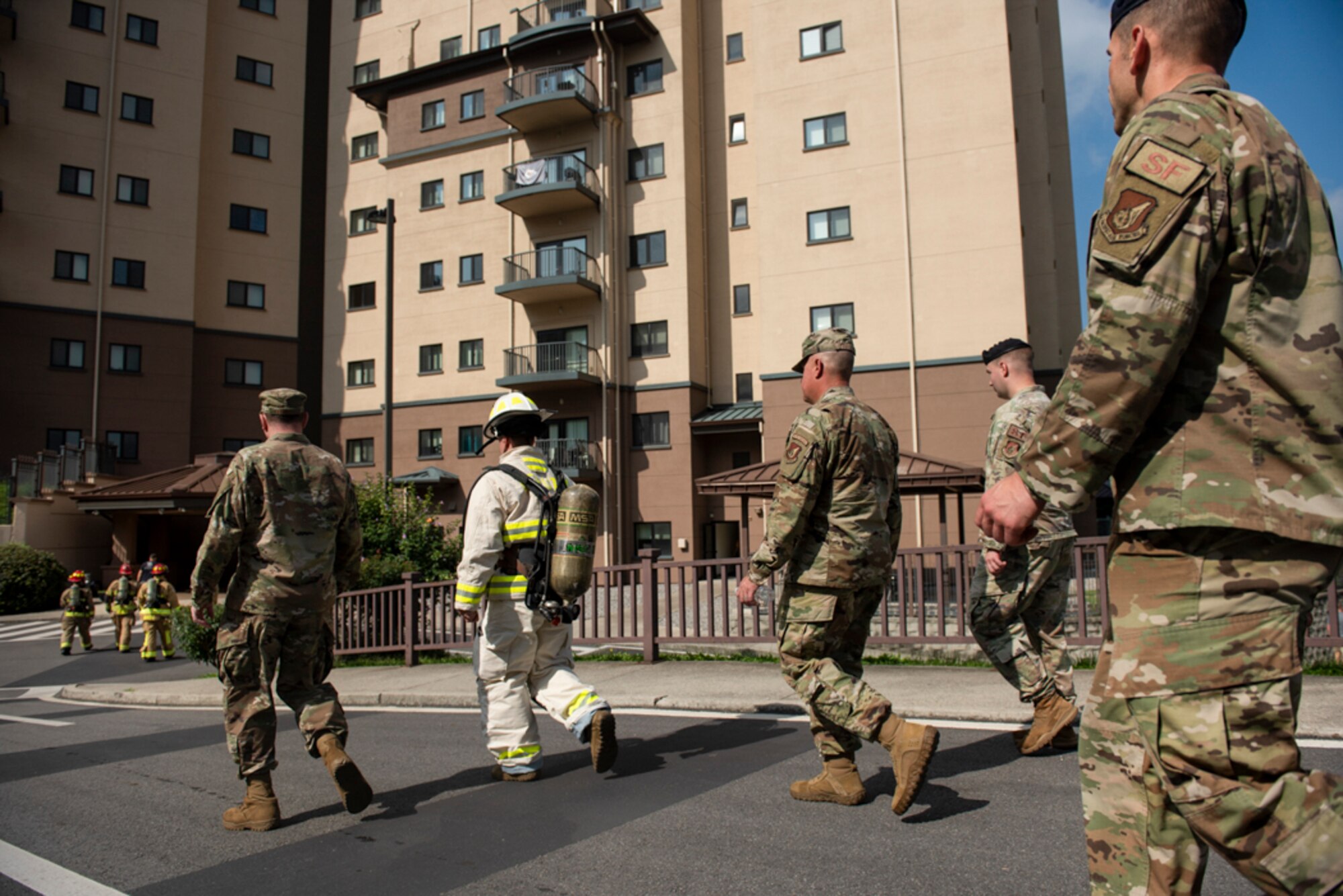 Col. Joshua Wood, 51st Fighter Wing commander and Chief Master Sgt. Justin Apticar, 51st Fighter Wing command chief, prepare to climb 110 flights of stairs during a 20th Anniversary 9/11 Remembrance Ceremony at Osan Air Base, Republic of Korea, Sept. 11, 2021.