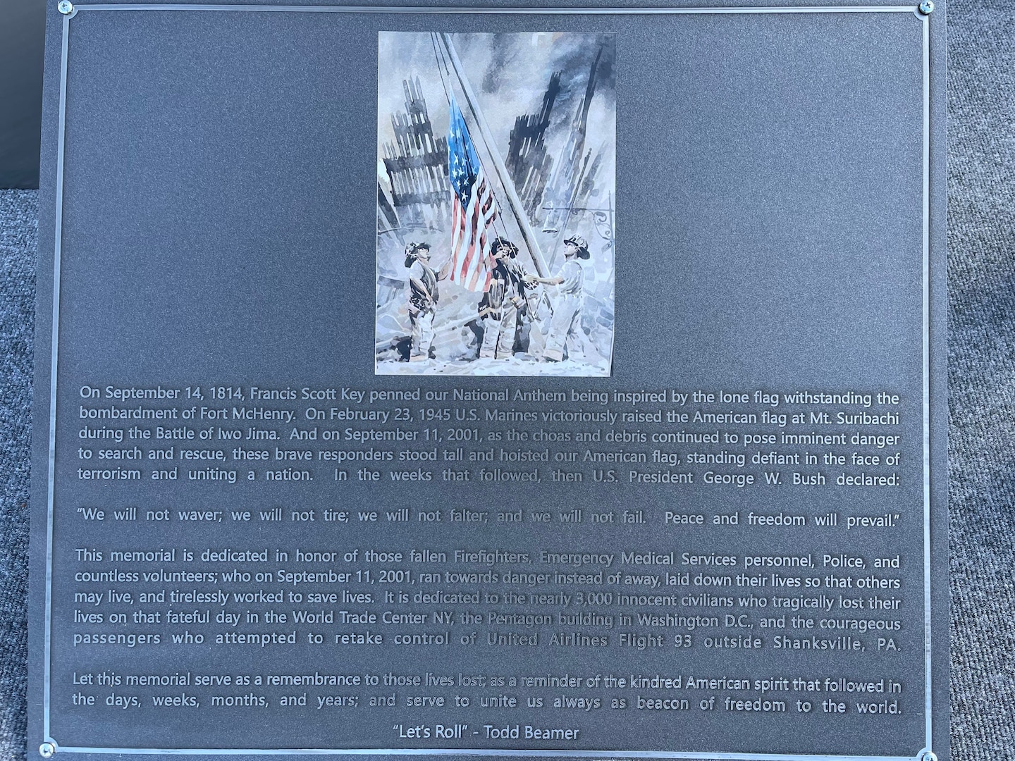 A memorial plaque fresh from laser etching is prepared to be placed at the bottom of the twin towers replica at Pease Air National Guard Base, New Hampshire, Sept. 10, 2021. The replica and plaque was designed and built by Pease Airmen. (Courtesy photo)