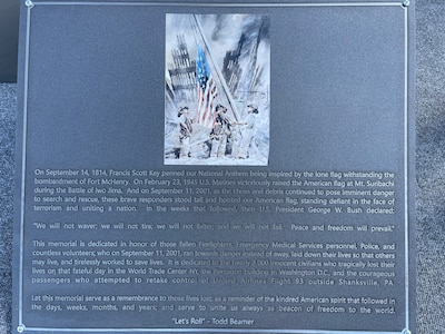 A memorial plaque fresh from laser etching is prepared to be placed at the bottom of the twin towers replica at Pease Air National Guard Base, New Hampshire, Sept. 10, 2021. The replica and plaque was designed and built by Pease Airmen. (Courtesy photo)