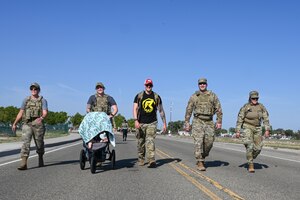 Team Kirtland Airmen participate in a ruck for the 20th anniversary of 9/11.
