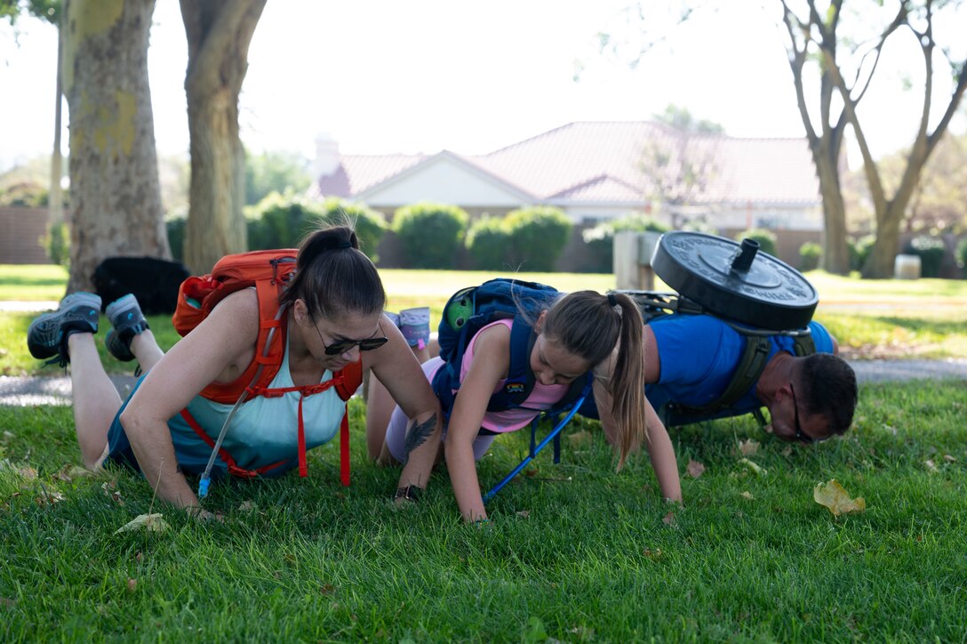 Team Kirtland Airmen perform push-ups for the 20th anniversary of 9/11.