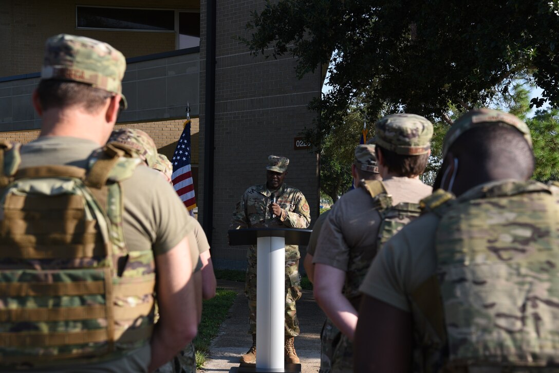 Chaplain (Maj.) Bitrus Cobongs, 403rd Wing Chaplain, gives the invocation before the 403rd Wing 20th Anniversary 9/11 Memorial Ruck March, which was hosted in rembrance of those who lost their lives during the events of 9/11. The march was led by the 403rd Security Forces Squadron and was open to all members of Keesler Air Force Base, both military and civilian. (U.S. Air Force photo by Master Sgt. Jessica Kendziorek)